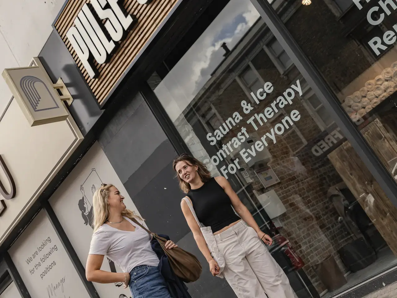 Two friends outside Pulse Club Fulham on North End Road