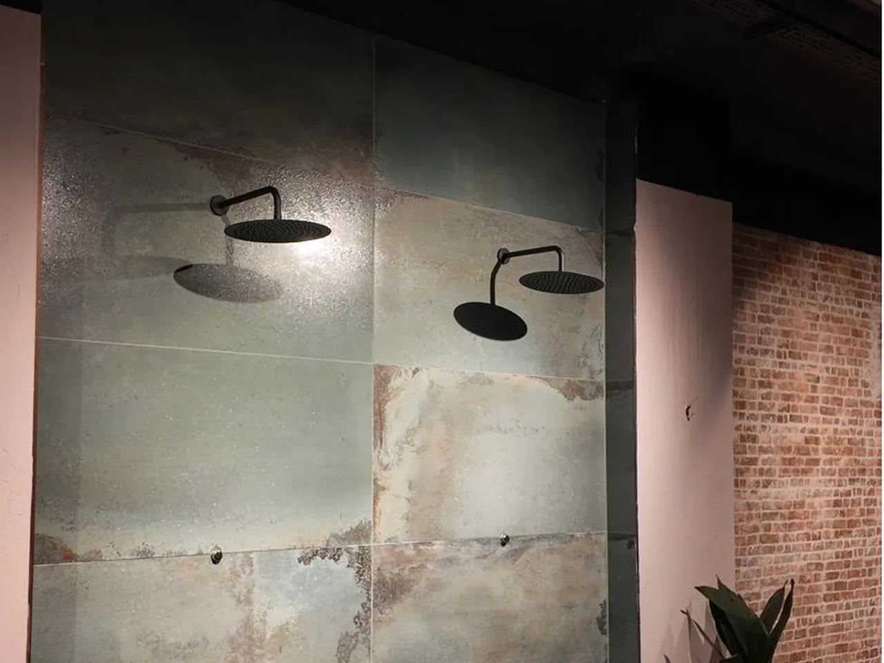 The rainfall showers and oxidised teal tiling at Pulse Club Fulham