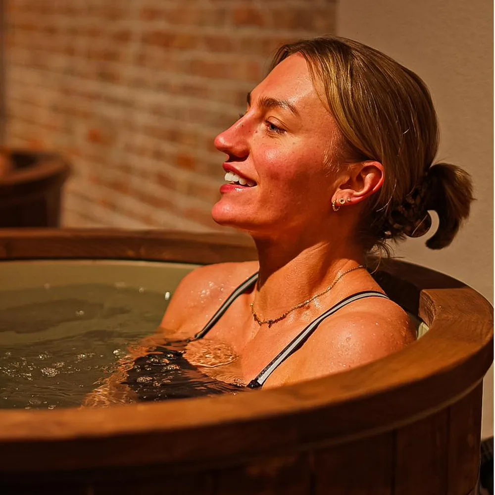 A member taking a cold plunge at Pulse Club