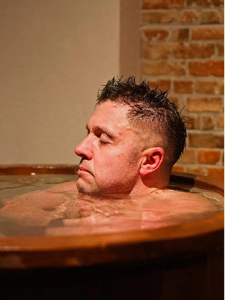 A member taking the plunge, cold-water immersion at Pulse Club